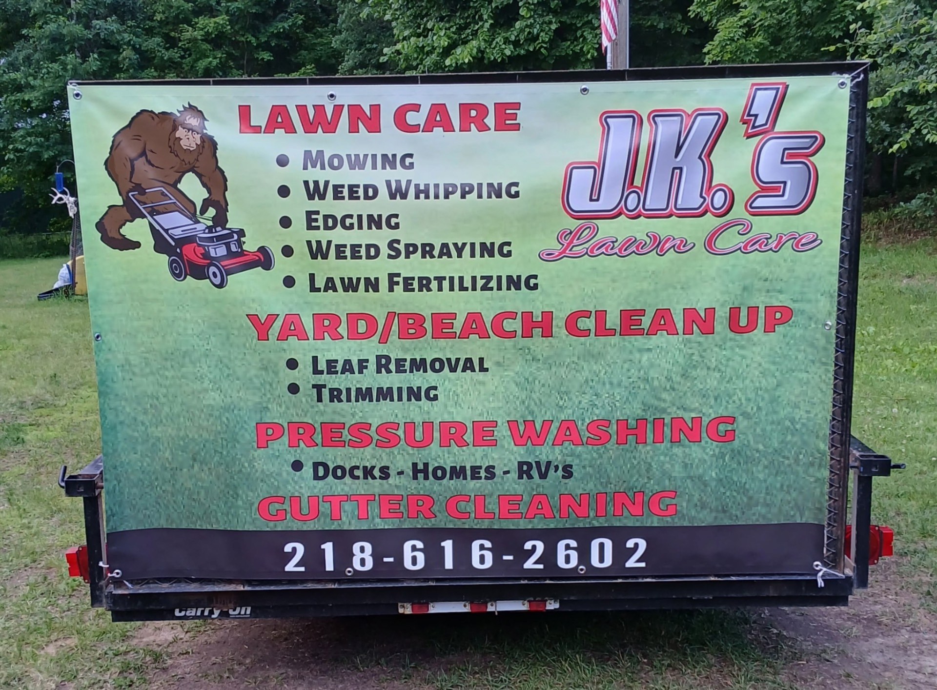 J.K.'s Lawn Care services banner listing lawn care, yard and beach cleanup, pressure washing, and gutter cleaning